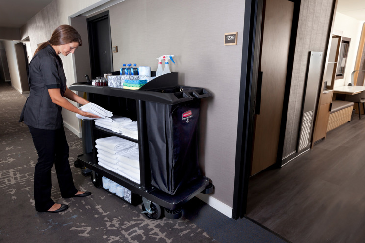 Staff getting towels from a Housekeeping Cart